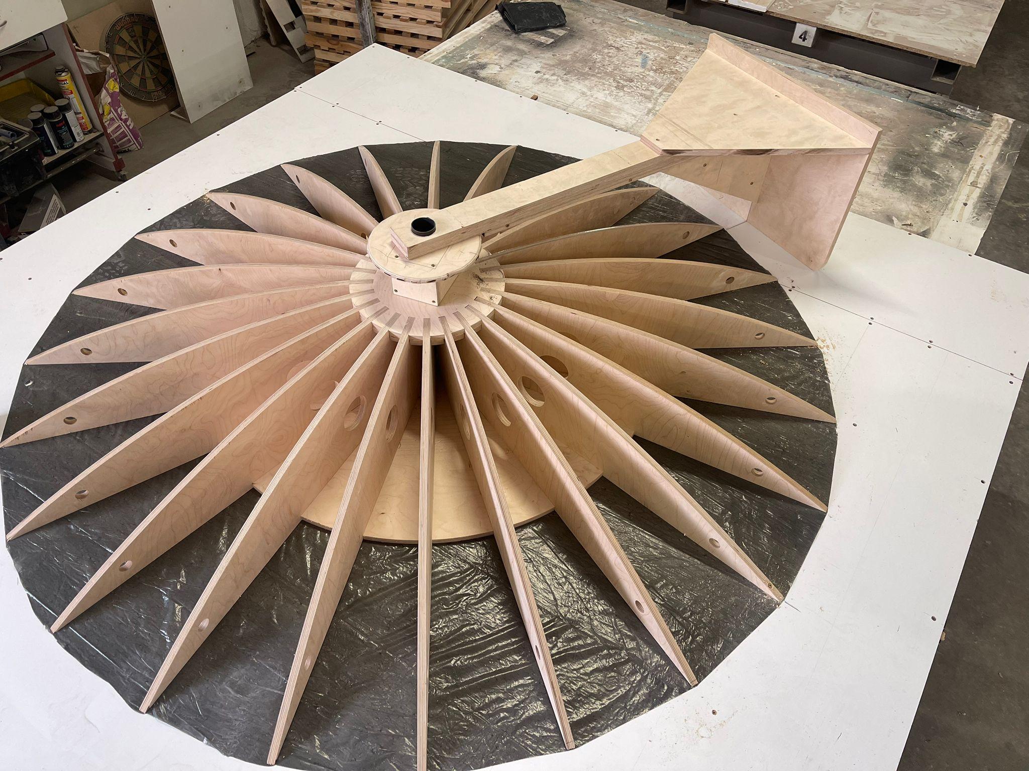 Geometric timber joinery structure viewed from overhead