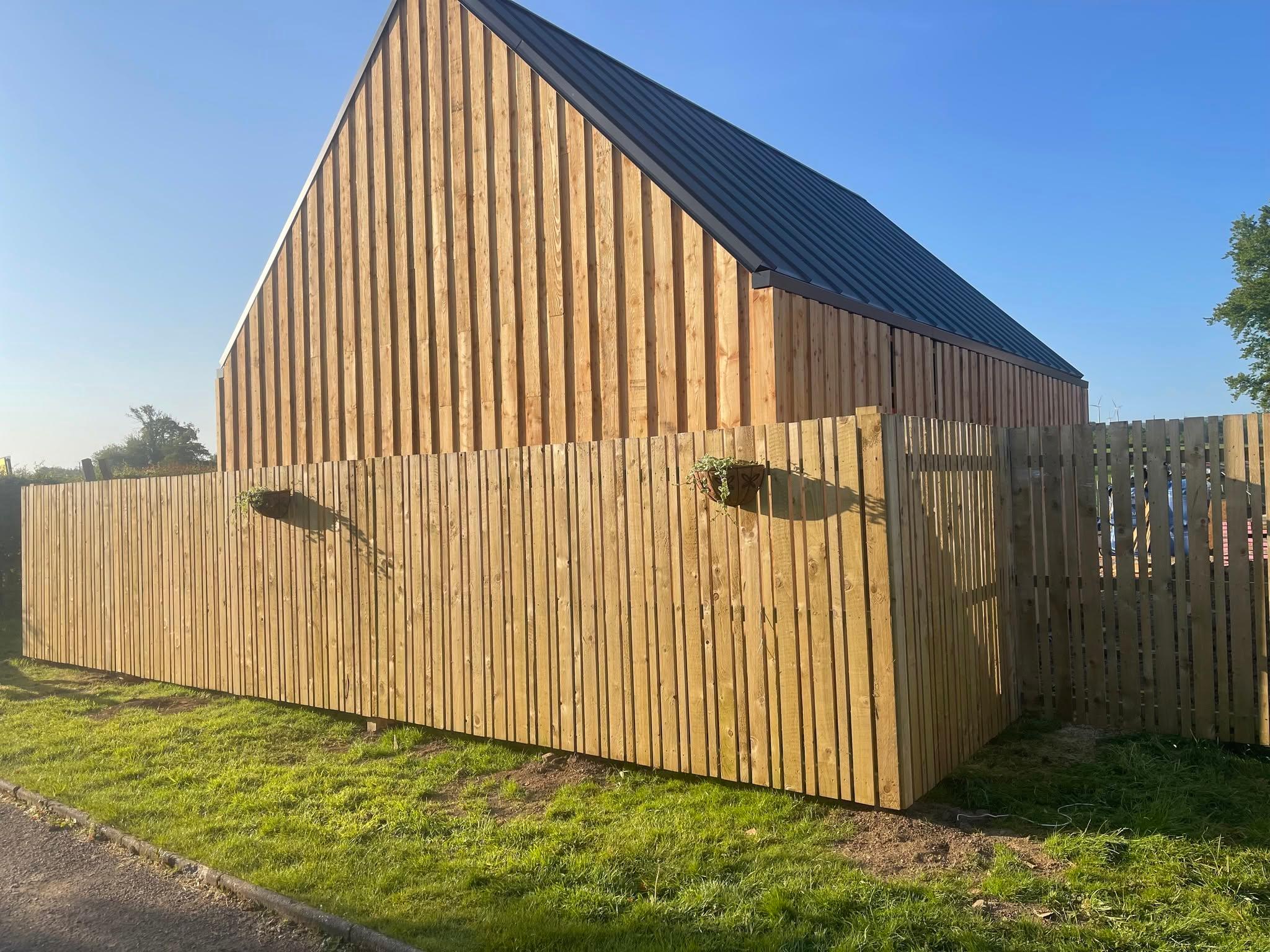 Timber cladding boards meeting at an angular junction