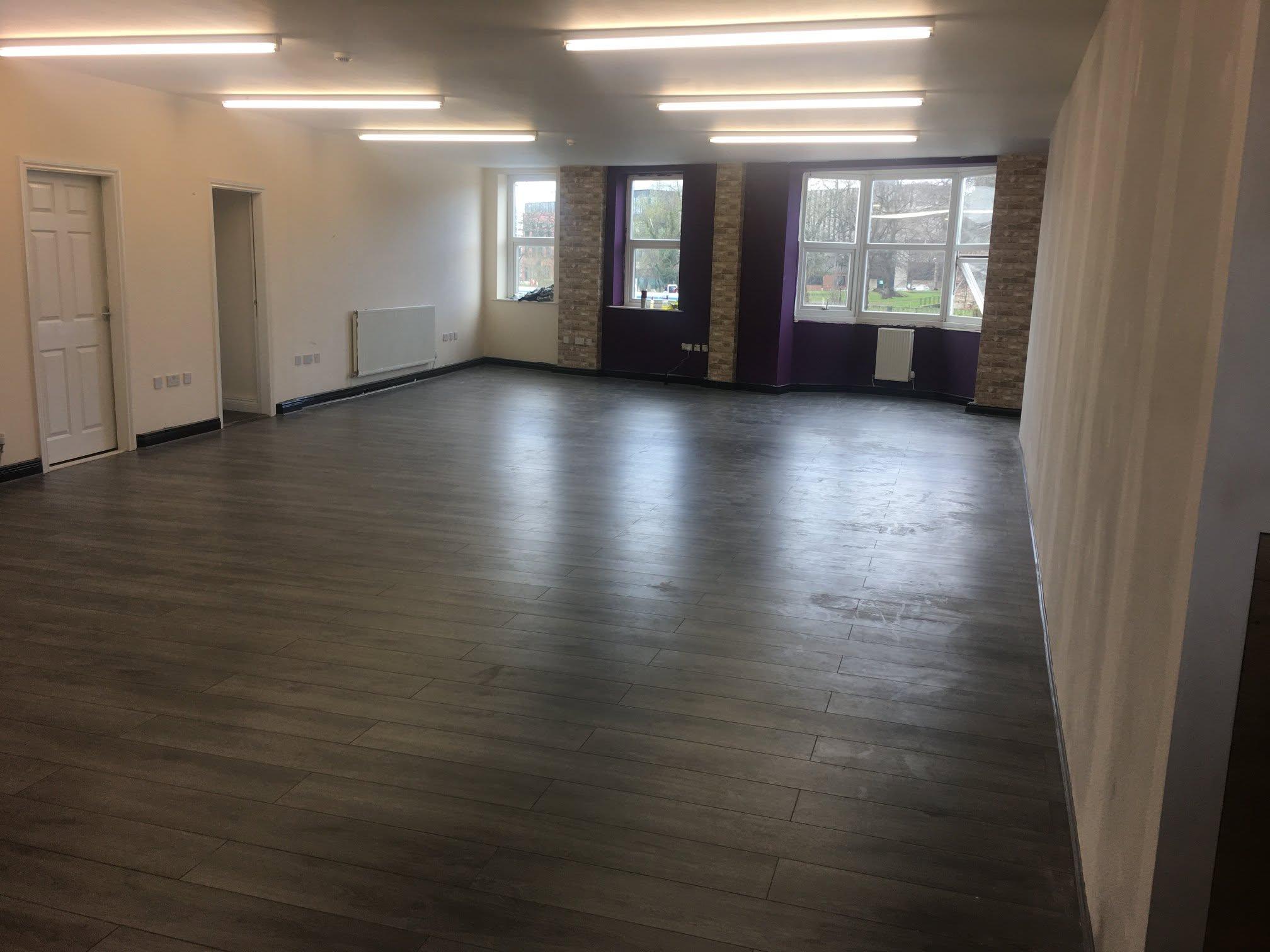 Flooring installation showing timber board alignment